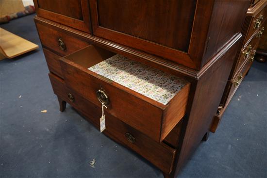 A George III Hepplewhite period mahogany dwarf linen press W. 3ft 9in. D.1ft 10in. H.5ft 6in.